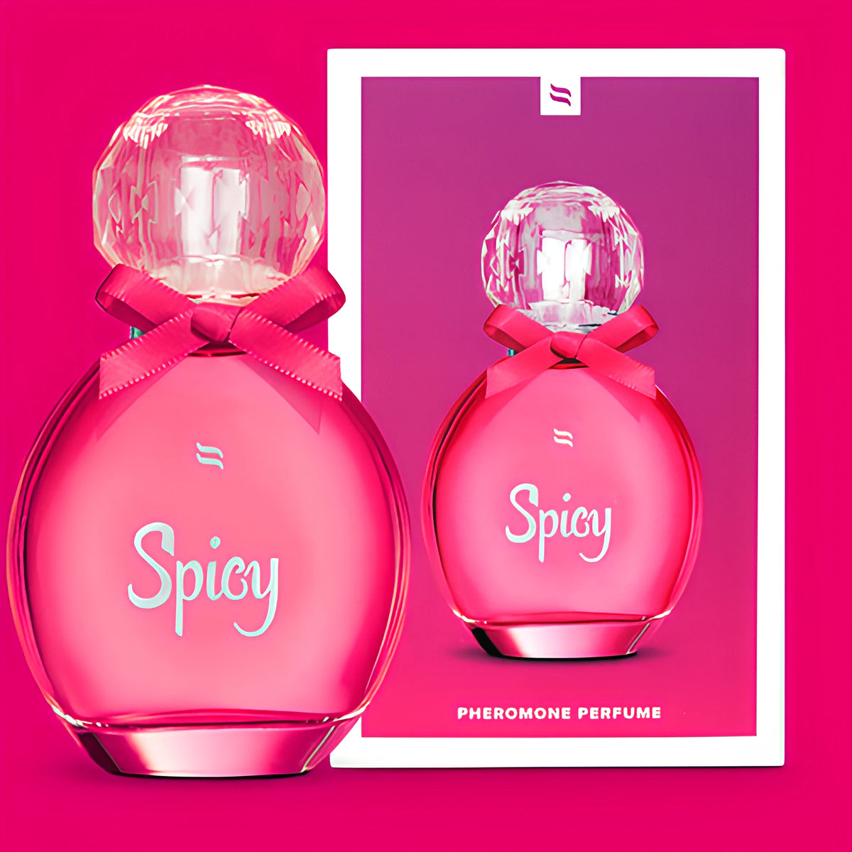 Феромонен парфюм Spicy на Obsessive: розов флакон с панделка и кристална капачка до розова кутия с надпис Pheromone Perfume