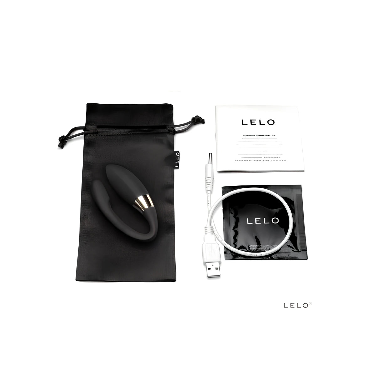 Lelo Noa в черно върху сатенена торбичка, до него бял USB кабел за зареждане, ръководство за употреба и черен пакет с лого на LELO