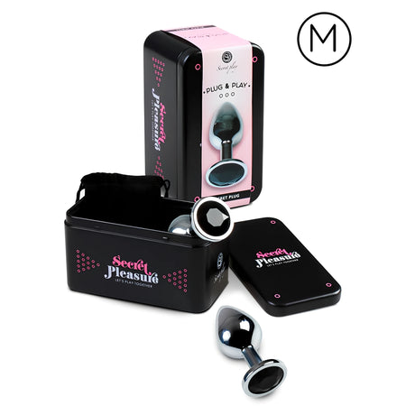 Метален разширител Secret Play размер M с черен кристал, пред черна метална кутия Secret Pleasure с капак и торбичка