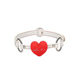 Бяла каишка със сребристи халки и червено сърце с ЕКГ линия от комплекта BDSM Nurse Pleasure на Ouch!, предна гледна точка
