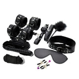 BDSM комплект от 10 части Control Me на Guilty Toys в черно: маншети, нашийник, превръзка за очи, камшик, перо, въже и щипки