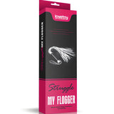 Розово-черна кутия на бич Struggle My Flogger на Lovetoy, на предния панел е изобразен бичът с бели ресни и дръжка с примка