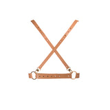 Дамски колан X harness на Bijoux Indiscrets в кафяв цвят – изглед отпред: кръстосани каишки със златисти халки и катарами върху бял фон