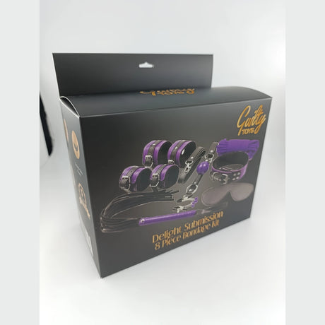 Черна кутия на комплект Guilty Toys Delight Submission 8 Piece Bondage Kit с лилави и черни аксесоари, заснета отстрани под ъгъл
