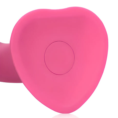 Дилдо Non-Phallic Vibrating Medium на Shots: close-up на розовата основа със сърцевидна форма и кръгъл детайл в центъра