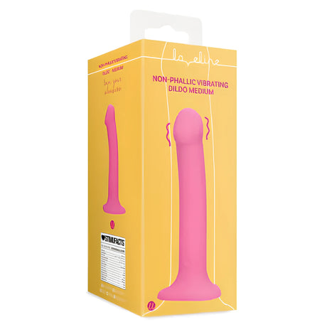Жълта кутия на вибриращо дилдо Non-Phallic Vibrating Medium от Shots с розов продукт на предния панел и таблица Stimufacts встрани