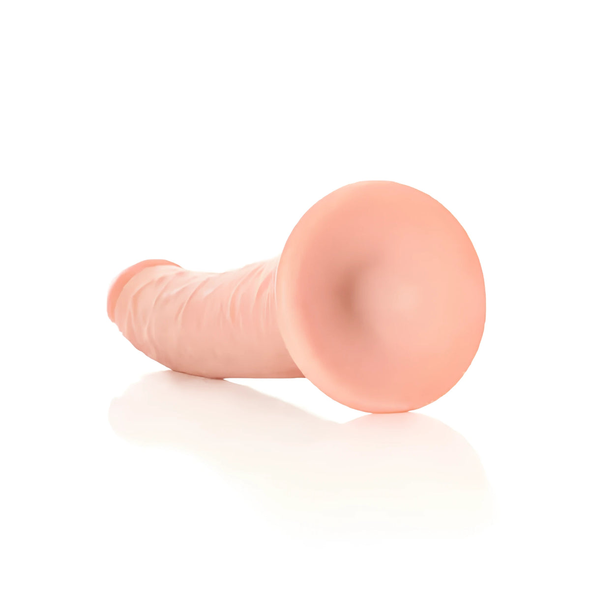 Real Rock Slim Realistic 20,5 cm в телесен цвят, поглед отзад към широката вендуза в основата, на бял фон