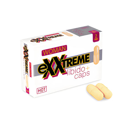 Бяла кутия eXXtreme libido+ caps Woman на HOT с 2 капсули, до нея две бежови капсули