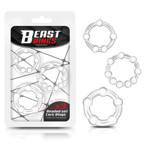 Опаковка Beast Rings на IntoYou с три прозрачни пръстена с топчета, а до нея трите пръстена в различни размери
