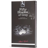 Тъмна кутия на комплект Fifty Shades of Grey Hard Limits Restraint Kit с четири черни маншета и сива маска за очи на лицевата страна