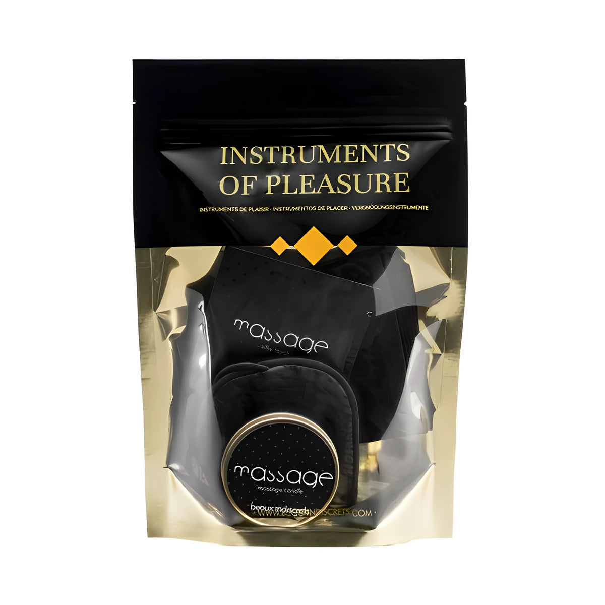Черно-златист плик на комплект Instruments of Pleasure на Bijoux Indiscrets, през прозореца се виждат масажна свещ и черни аксесоари