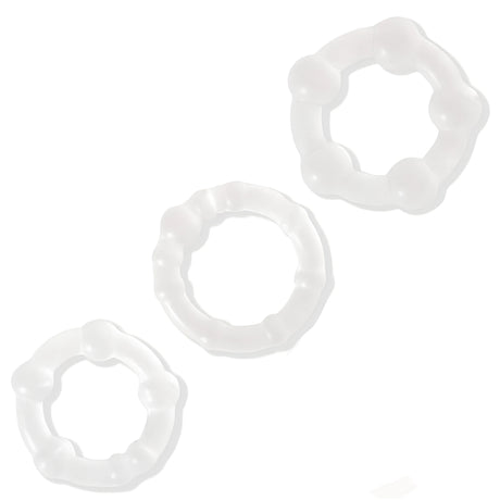 Комплектът Triple Beaded на Lovetoy: три прозрачни силиконови пръстена с топчета в различен размер на бял фон
