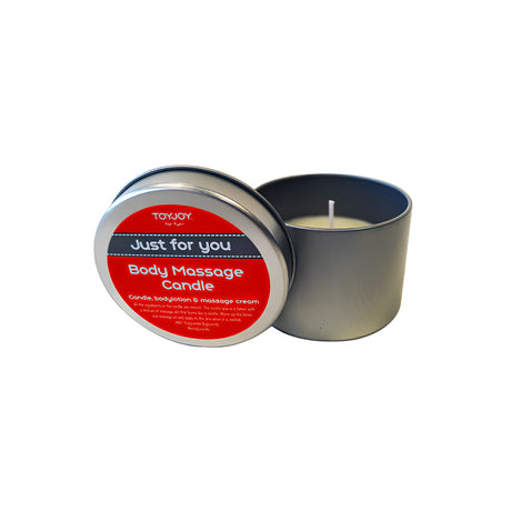 Масажна свещ ToyJoy „Just for you“ в сива метална кутия с отворен капак с червен етикет „Body Massage Candle“