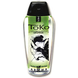 Прозрачна бутилка Shunga Toko Aroma с черна капачка и зелен етикет с вкус пъпеш и манго, 165 мл, с японска илюстрация