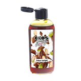 Бутилка Eros Yummy Dubai Delight 100 ml с отворен черен капак, кехлибарена течност и етикет с шоколад и шамфъстък