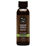 Кафява бутилка масажно олио Hemp Seed на Earthly Body с черна капачка и зелена лента на етикета „Naked in the Woods“, 60 мл