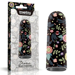 Мини вибратор Diana на Lovetoy с черен корпус и цветя, до кутията си с надпис Diana Massager и 10 скорости и модела