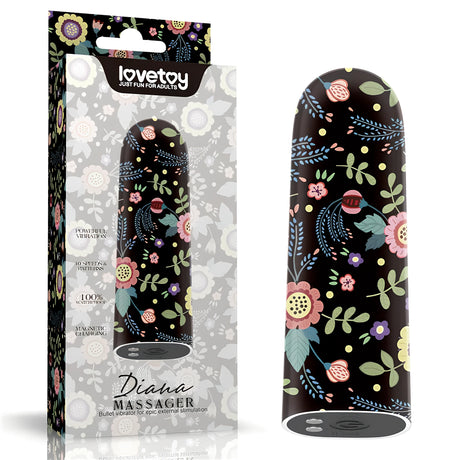 Мини вибратор Diana на Lovetoy с черен корпус и цветя, до кутията си с надпис Diana Massager и 10 скорости и модела