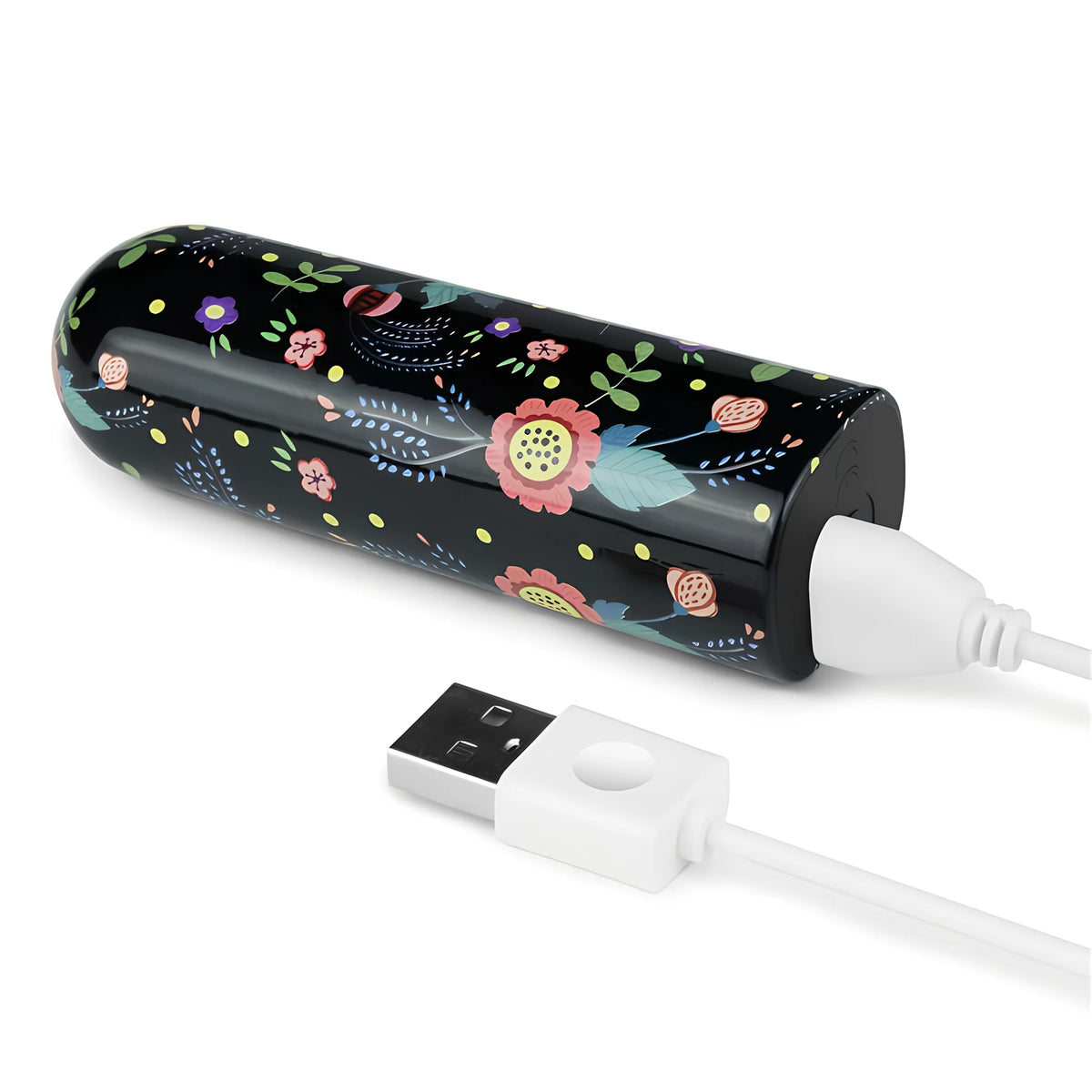 Мини вибратор Diana на Lovetoy с черен корпус и цветя, свързан с бял USB кабел за зареждане