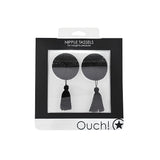 Кръгли черни пастиси с пискюли на Ouch! в кутия с прозрачен прозорец и надпис Nipple Tassels, for naughty pleasure