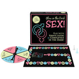 Кутията на играта Glow in the Dark Sex! на Kheper Games с игралното табло, въртящо колело и две фигурки пред нея