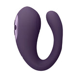 Стимулатор Yoko Purple в лилав цвят, страничен изглед на извития корпус с бутони за управление върху светлолилава плоча