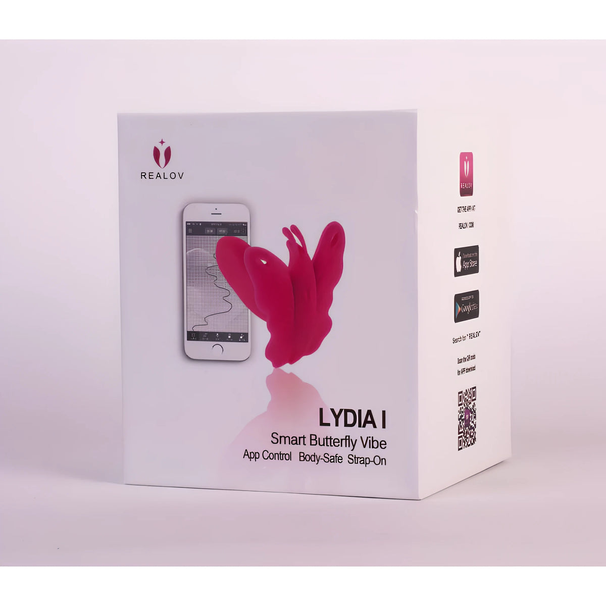 Бяла кутия на Realov Lydia I Smart Butterfly Vibe с розова пеперуда и телефон с приложението; на страничната стена са QR код и бутони за изтегляне