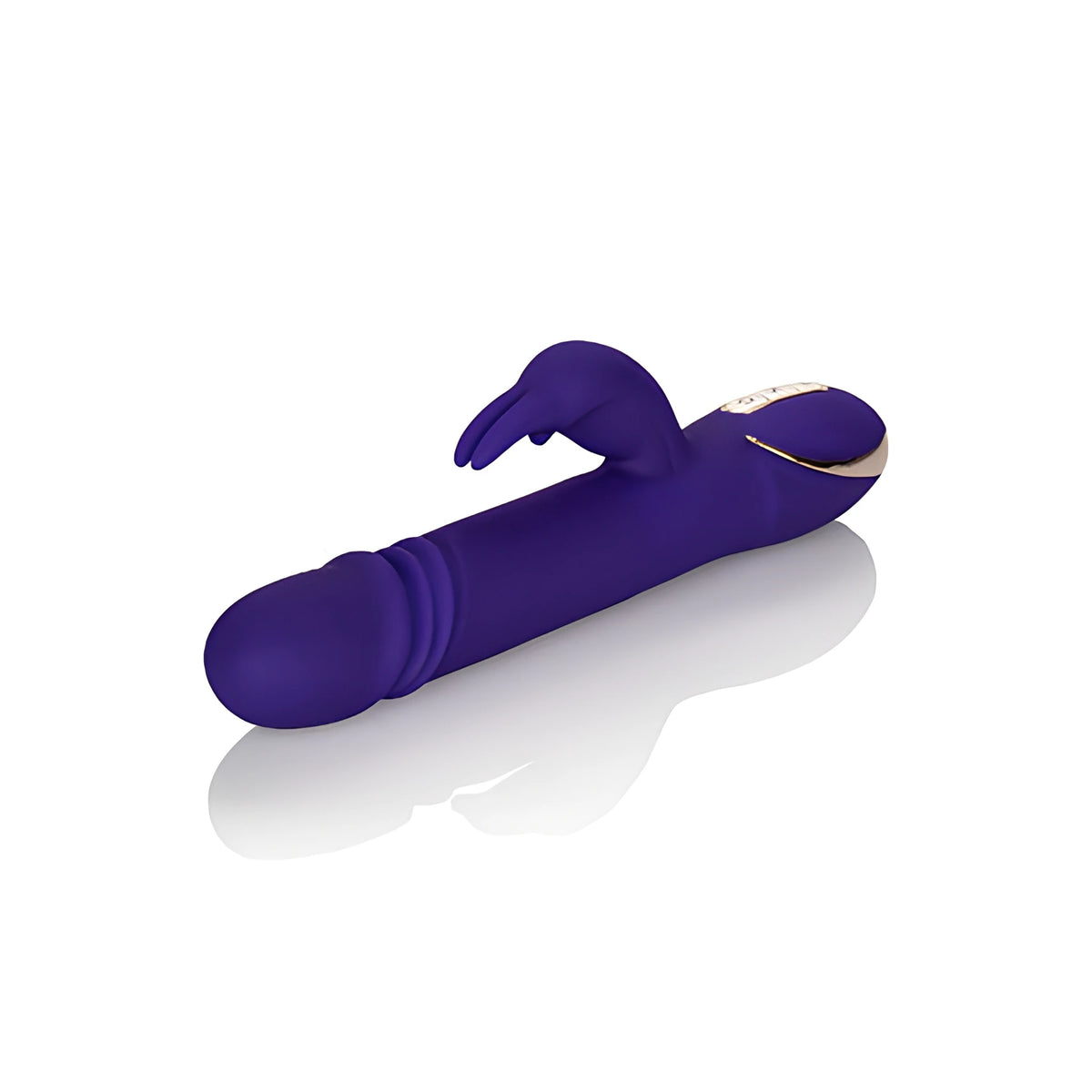 Лилавият вибратор Thrusting Rabbit Signature на California Exotic, поставен настрани, със златист панел с бутони и ребрест връх