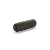 Черен матов виброкуршум X-basic Mini 10 speed на Lovetoy, легнал настрани, с бутон за управление в единия край на бял фон