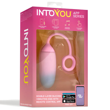 Розова кутия на виброяйце IntoYou App Series с прозорец към розово-синьо яйце с пръстен и текст за контрол през приложение